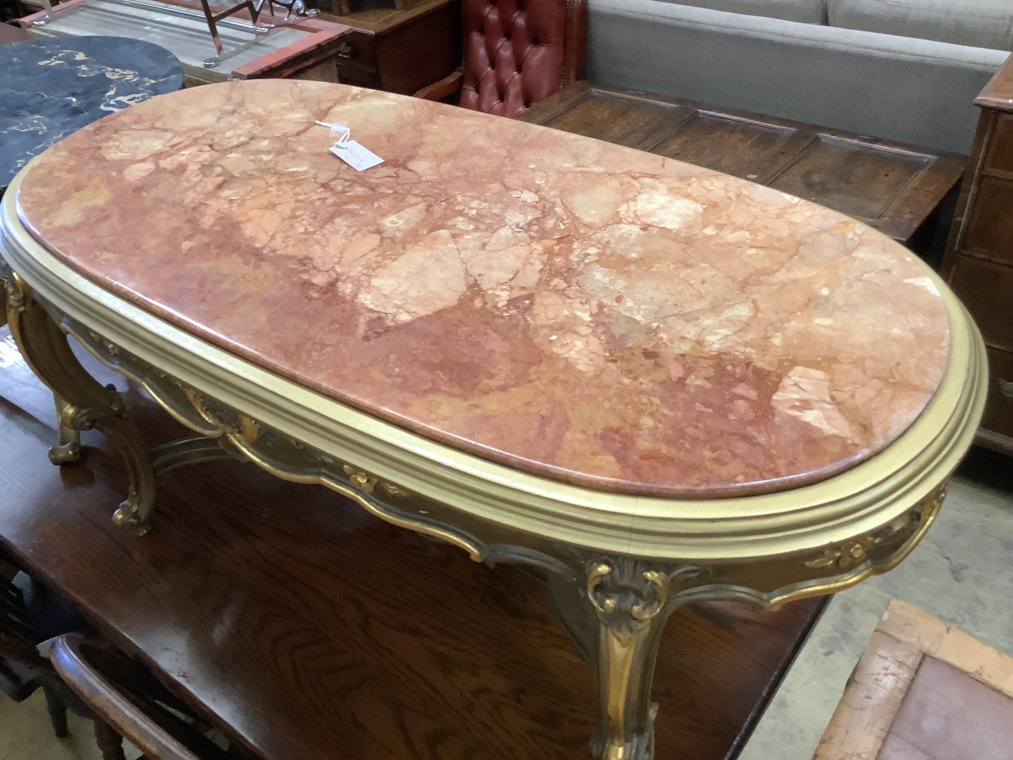 A circular gilt metal low coffee table with variegated marble top, diameter 62cm together with a larger faux marble coffee table